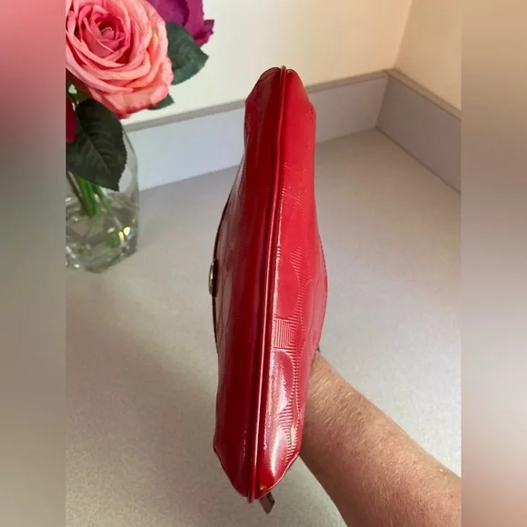 Coach Glossy Embossed Signature Wristlet
Cranberry Patent Leather Red - Picture 9 of 13